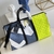 Bolso de Viaje Louis Vuitton Keepall 50B en Azul y Amarillo: Un elegante bolso de viaje de Louis Vuitton, con un diseño en tonos azules y detalles en amarillo, perfecto para viajes y aventuras.