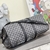 Bolsa de viaje Louis Vuitton Keepall 50B Damier Graphite: una bolsa de viaje elegante y sofisticada con el patrón Damier Graphite de Louis Vuitton, perfecta para viajes cortos o como equipaje de mano.