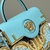 Fendace Fendi × Versace La Medusa Medium Baroque Bag Gold/Blue: An elegant and luxurious bag, with details in gold and blue, combining the distinctive style of Fendi and Versace, evoking baroque design.