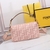 Fendi Baguette Bag in Canvas FℲ Pink: A charming Fendi Baguette bag in canvas with the iconic FF monogram in pink, perfect for adding a touch of elegance to your look.