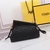 Fendi First Small Interlaced Leather Bag Negro: Un pequeño bolso de Fendi, en piel entrelazada negra, elegante y versátil para ocasiones informales o formales.