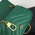 Gucci Marmont Super Mini Chevron Matelassé Bag in Green: An elegant small bag with a chevron pattern in matelassé, in green, perfect for adding a touch of vibrant style to your look.