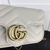 Gucci Marmont Super Mini Chevron Matelassé Bag in White: An elegant small bag with a chevron pattern in matelassé, in white, ideal to complement any look with sophistication and style.