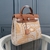 Hermès 2021 Toile Brides de Gala Herbag Zip 31 in Beige and Brown: This bag features an exclusive design with elegant details, perfect for those looking for style and sophistication in their fashion accessory.