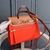 Hermès Hermès Herbag Zip 31 Canvas Orange/Brown Bag: A vibrant bag with orange and brown details, adding a pop of color to your look.