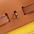 Hermès Hermès Herbag Zip 31 Canvas Bag Yellow/Brown: This bag displays a vibrant combination of colors, perfect for adding a touch of joy and style to your look.