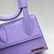 Jacquemus Le Chiquito Noeud Leather Purple Bag: A small bag in purple leather with bow detail, perfect for adding a touch of sophistication and color to your look.