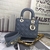 Bolsa Lady Dior Small Cannage Lambskin Dark Gray: Elegante bolsa de couro cinza escuro, com o icônico padrão cannage da Dior, ideal para um look sofisticado e moderno.