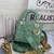 Bolsa Lady Dior Small Patent Leather Light Green: Uma elegante bolsa de couro verde claro patenteado, ideal para um visual fresco e primaveril, expressando estilo e sofisticação.