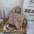 Bolso Lady Dior Small Charol Nude: Un elegante bolso de lujo en charol nude, perfecto para ocasiones formales e informales, que transmite sofisticación y estilo atemporal.