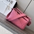 Loewe Small Puzzle Grained Calfskin Bag in Pink: A small Loewe Puzzle bag in pink grained leather, adding a touch of delicacy and elegance to the look.