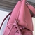 Loewe Small Puzzle Grained Calfskin Bag in Pink: A small Loewe Puzzle bag in pink grained leather, adding a touch of delicacy and elegance to the look.