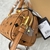 MCM Mini "Brown" Bag: An MCM mini bag in brown, elegant and versatile, ideal for complementing casual or sophisticated looks.