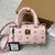 MCM Mini "Pink" Bag: A mini MCM bag in pink, vibrant and modern, perfect for adding a touch of color to your look.