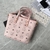 MCM Tote "Pink" Bag: A vibrant pink MCM tote, perfect for adding a pop of color and style to any ensemble. Ideal for casual or elegant use.