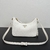 Prada Mini Bag in White Saffiano Leather": A mini bag from Prada in white saffiano leather, perfect for adding a touch of elegance and sophistication to your look.