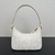 Prada Mini Bag in White Saffiano Leather": A mini bag from Prada in white saffiano leather, perfect for adding a touch of elegance and sophistication to your look.