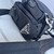 A Prada crossbody bag, made from the brand's sustainable Re-Nylon material, featuring Prada's signature logo. This bag combines contemporary style with environmental concerns, making it ideal for everyday use. With a sophisticated and functional design, i