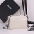 Yves Saint Laurent Niki White" Bag: An elegant white bag from Yves Saint Laurent, perfect for a sophisticated and modern look.