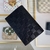 Louis Vuitton Black Passport Cover: An elegant and luxurious black Louis Vuitton passport cover featuring the iconic LV monogram.