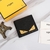 Carteira Fendi Bad Bugs em preto e amarelo: Esta carteira da Fendi exibe o icônico design Bad Bugs em preto e amarelo, perfeita para adicionar um toque de estilo e personalidade ao seu visual.