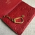 Louis Vuitton Key Pouch Monogram Empreinte Cerise wallet in red: a vibrant and luxurious accessory to organize your keys with elegance.