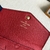 Carteira Louis Vuitton Key Pouch Monogram Empreinte Cerise em vermelho: um acessório vibrante e luxuoso para organizar suas chaves com elegância.