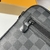 Louis Vuitton "Damier Graphite" Clutch: An elegant handbag in a Damier Graphite pattern, perfect for a modern and refined look.