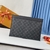 Louis Vuitton "Monogram Black" Clutch: A sophisticated black monogram handbag, a versatile accessory for any occasion.