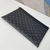 Louis Vuitton "Monogram Black" Clutch: A sophisticated black monogram handbag, a versatile accessory for any occasion.