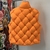 Bottega Veneta "Orange" Vest: A vibrant orange vest from Bottega Veneta, adding a pop of color and style to any look.