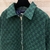 Gucci GG Wool Flannel Padded "Green" Jacket: A green GG patterned quilted jacket from Gucci, made from wool flannel, ideal for style and comfort in cold weather.