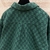 Gucci GG Wool Flannel Padded "Green" Jacket: A green GG patterned quilted jacket from Gucci, made from wool flannel, ideal for style and comfort in cold weather.