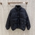 Gucci Jumbo GG Canvas Down Jacket "Black": A black quilted jacket with Gucci's iconic GG pattern, perfect for staying stylish and keeping warm on cold days.