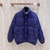 Gucci Jumbo GG Canvas Down "Blue" Jacket: A blue quilted jacket with Gucci's emblematic GG pattern, elegant and ideal for cold days with a touch of style.