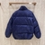 Gucci Jumbo GG Canvas Down "Blue" Jacket: A blue quilted jacket with Gucci's emblematic GG pattern, elegant and ideal for cold days with a touch of style.