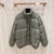 Gucci Jumbo GG Canvas Down "Green" Jacket: A green GG pattern quilted jacket from Gucci, perfect for cold weather and urban style.