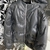 This standout jacket is made from soft lambskin and quilted with certified down feathers. Monogram signatures are hot stamped into the leather, creating an upholstery effect with deep buttons. This piece has a hood with integrated visor and high collar, c