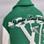 Chaqueta "verde" de cuero mixto con múltiples parches universitarios de Louis Vuitton: una chaqueta Louis Vuitton verde con múltiples parches en cuero mixto para una apariencia deportiva y lujosa.