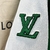 Jaqueta Louis Vuitton Varsity Multi-Patches Mixed Leather "Green": Uma jaqueta verde da Louis Vuitton com vários remendos em couro misto, para um visual esportivo e luxuoso.