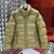 Prada Puffer Jacket "Beige": A quilted jacket from Prada, in beige, ideal for cold weather and for an urban and sophisticated style.