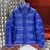 Prada Puffer "Blue" Jacket: A quilted jacket from Prada, in blue, ideal for cold weather and for an urban and sophisticated style.