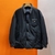 Prada Re-nylon "Black" Jacket: A black nylon jacket from Prada for a sophisticated, contemporary urban look.