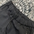 Calça Prada Technical Fabric "Black": Uma calça preta feita de tecido técnico premium da marca de luxo Prada.