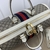 Mala de Mão Gucci Savoy Maxi Duffle White and Ebony: Uma elegante mala de mão da Gucci com detalhes em branco e ébano, perfeita para viagens luxuosas e estilo refinado.