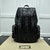 Mochila Gucci GG Embossed "Black": Uma mochila preta com padrão GG em alto relevo, perfeita para um visual sofisticado e contemporâneo.