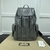 Gucci GG Embossed "Gray" Backpack: A gray backpack with an embossed GG pattern, ideal for an urban and elegant style.