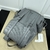 Gucci GG Embossed "Gray" Backpack: A gray backpack with an embossed GG pattern, ideal for an urban and elegant style.