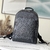 Mochila Louis Vuitton Adrian Taiga em Preto: Uma mochila luxuosa em couro Taiga na cor preta, ideal para quem busca elegância e praticidade em seu dia a dia.