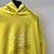 Balenciaga Surfer Hoodie "Yellow": Una sudadera amarilla vibrante de Balenciaga con estampado surfista, ideal para un look atrevido y elegante.